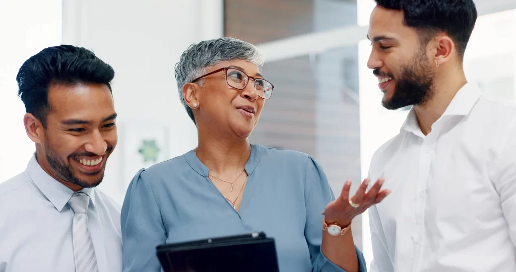 Colleagues training on an iPad about Instructional Technology